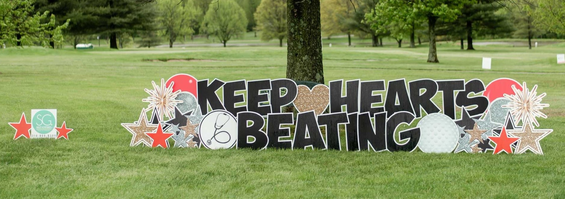 Sign saying "Keep Hearts Beating"