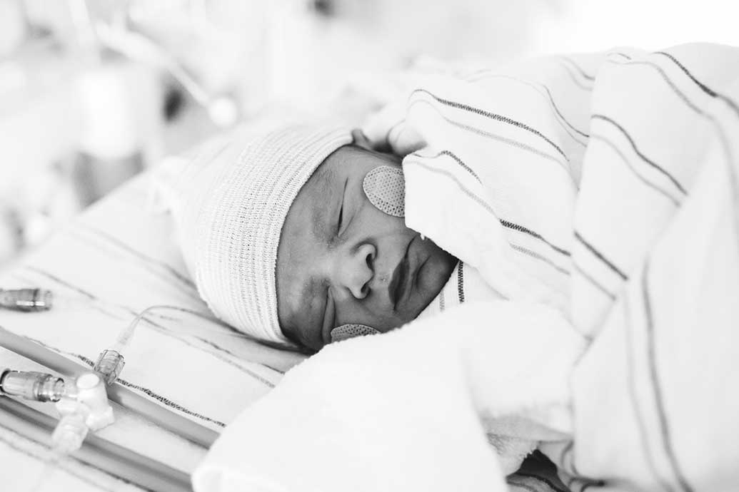 Baby sleeping soundly in medical bed